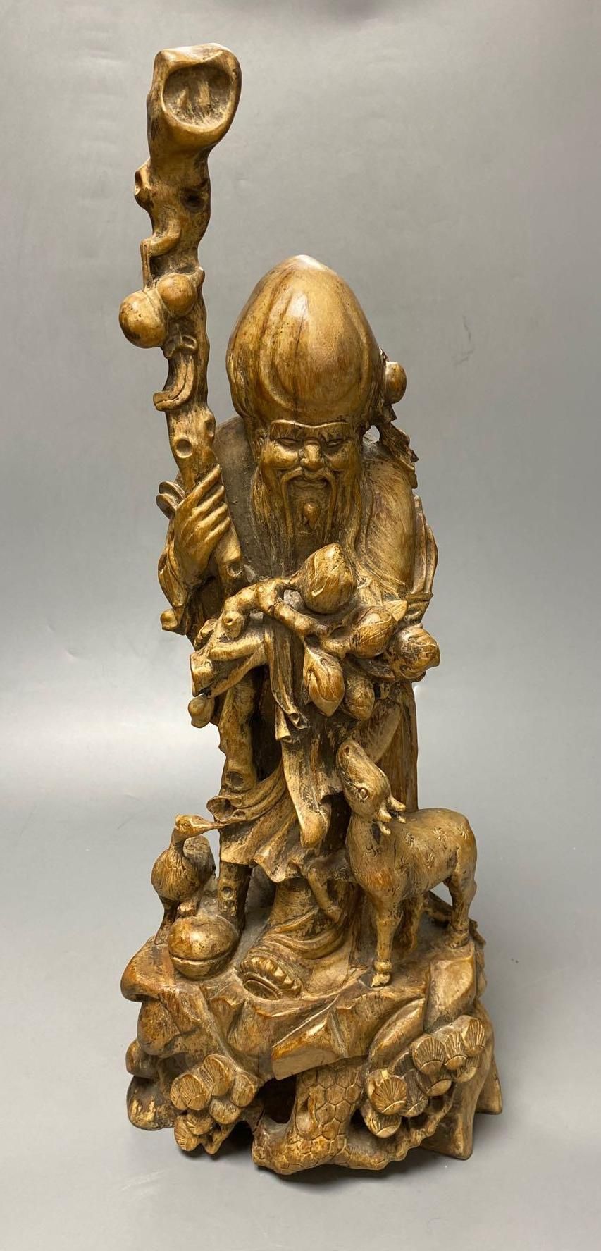 A Chinese carved hardwood figure of Shou Lao, 53cm